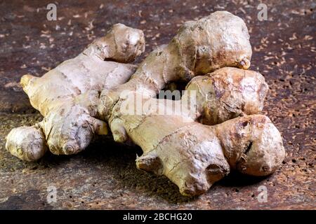 Close-up of ginger root, which is lying on the table in the kitchen Stock Photo