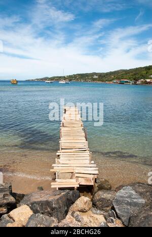 The wooden pier in Coxen Hole town on Roatan Island, popular port of call in Caribbean (Honduras). Stock Photo