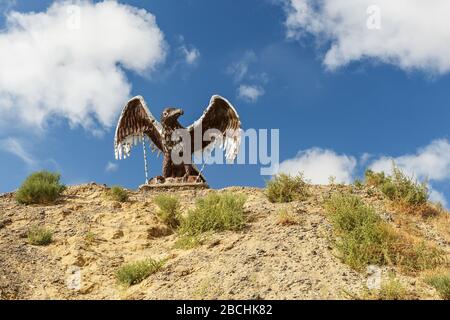 Kazaly District, Kazakhstan - August 31, 2019: Eagle statue with spread wings on the mountain in the steppe of Kazakhstan. Stock Photo