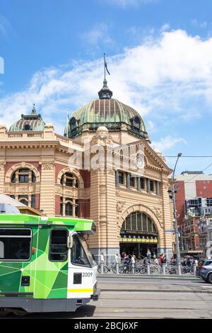 Tram passing Flinders Street Station, Flinders Street, City Central, Melbourne, Victoria, Australia Stock Photo