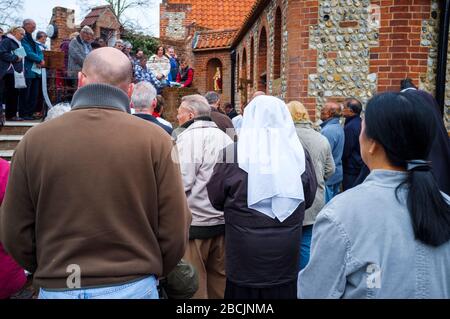 Pilgrims and visitors taking part in the Stations of the Cross walk at The Shrine of Our Lady of Walsingham on Good Friday to mark the story of Christ Stock Photo