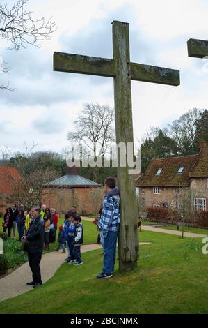 Pilgrims and visitors taking part in the Stations of the Cross walk at The Shrine of Our Lady of Walsingham on Good Friday to mark the story of Christ Stock Photo