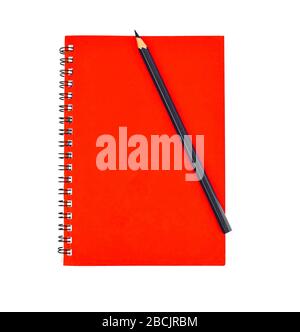 Black pen on top of a red color covered single note paper diary isolated on an empty white background Stock Photo