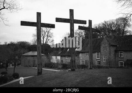 Pilgrims and visitors taking part in the Stations of the Cross walk at The Shrine of Our Lady of Walsingham on Good Friday to mark the story of Christ Stock Photo