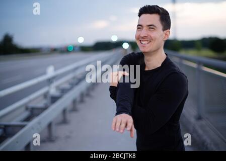 Attractive, muscular man doing sports Stock Photo