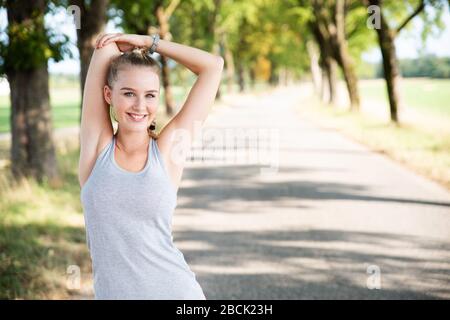 young woman stretching Stock Photo