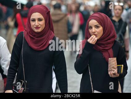 Turkish women wearing matching pashminas in Istiklal avenue, Istanbul. Turkey Stock Photo