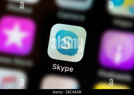 A close-up shot of the Skype app icon, as seen on the screen of a smart phone (Editorial use only) Stock Photo