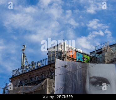 Bucharest, Romania - March 17, 2020: Many GSM telecommunications antennas are installed dangerously very close to the apartments located in a building Stock Photo