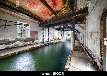 Abandoned boathouse interior urban exploration hdr Stock Photo