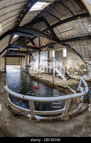 Abandoned boathouse interior urban exploration hdr fisheye shot Stock Photo