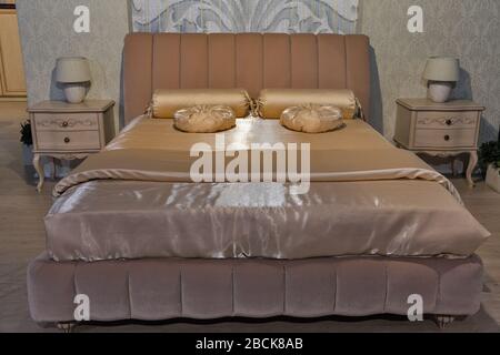 Empty modern elegant bedroom interior in baroque style with pillows Stock Photo