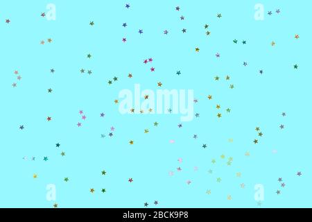 Falling confetti background. Sparkles on pastel blue trendy background. Festive backdrop for your projects. Stock Photo