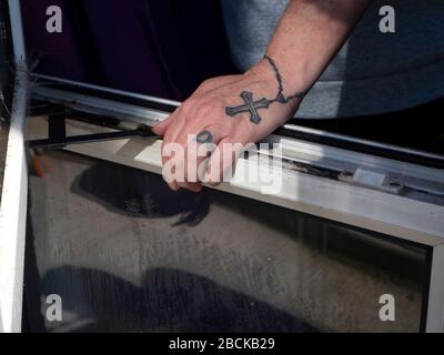Tattoo of ring cross and chain around fingers wrist and hand Stock Photo   Alamy
