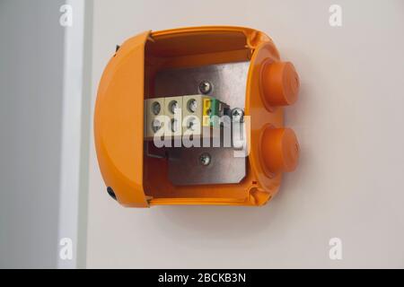 Wires and clam terminals to open the electrical distribution box. Industry Stock Photo