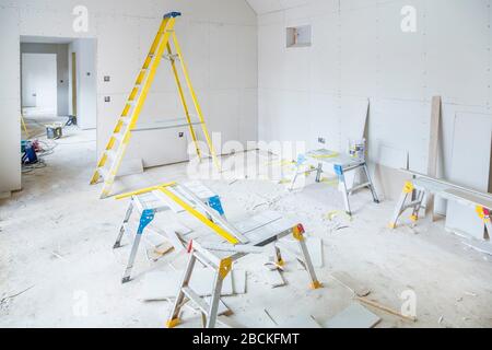 Gypsum plasterboard installation in a room interior during a house renovation Stock Photo
