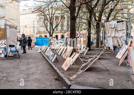 Lviv, Ukraine - January 21, 2020: Historic Ukrainian Lvov city in old town with people at bazaar flea market in center downtown in winter Stock Photo