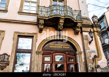 Lviv, Ukraine - January 21, 2020: Ukrainian Lvov city in old town rynok square street and cafe museum entrance sign exterior with nobody Stock Photo