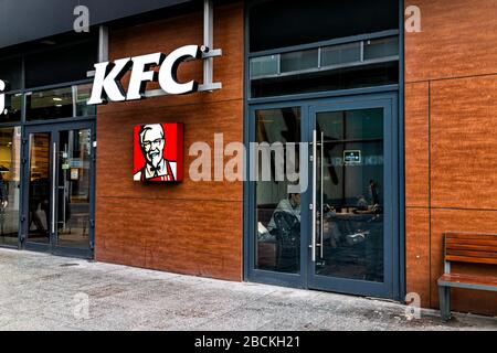 Warsaw, Poland - January 22, 2020: KFC fast food chain restaurant with logo sign by entrance near Centrum city center in Warszawa Stock Photo