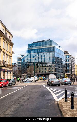 Warsaw, Poland - January 22, 2020: Wework co-working office space building in downtown center of Warszawa with outside outdoor view on street road Stock Photo