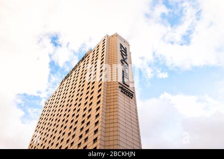 Warsaw, Poland - January 22, 2020: Downtown Warszawa on aleje Jerozolimskie road on cloudy winter day with Novotel hotel sign on modern building Stock Photo