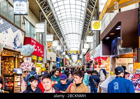 Tokyo, Japan - March 30, 2019: Asakusa ward with crowd of people on Nakamise Shopping Street Arcade covered shops with ceiling Stock Photo