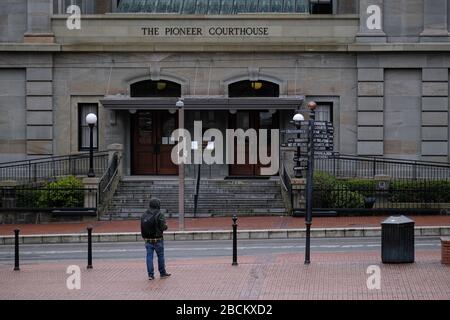 Portland, USA. 03rd Apr, 2020. A lone figure walks through Pioneer Courthouse Square in Portland, Ore., on April 3, 2020, as people continue to practice social distancing measures in conjunction with a statewide stay-at-home order to slow the spread of the novel coronavirus. (Photo by Alex Milan Tracy/Sipa USA) Credit: Sipa USA/Alamy Live News Stock Photo