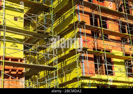 Exterior view of new multistory wooden residential building facade under construction in Silicon Valley - San Jose, California, USA - 2020 Stock Photo