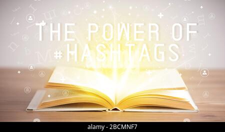 Open book with THE POWER OF #HASHTAGS inscription, social media concept Stock Photo