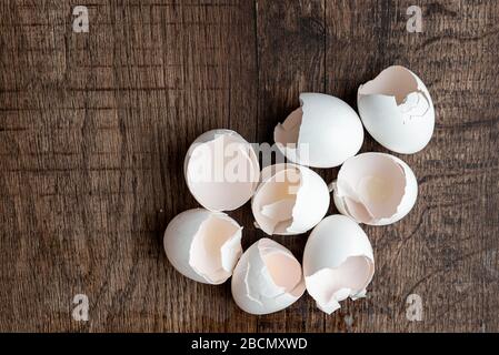 Eight eggshells on a dark wood table Stock Photo