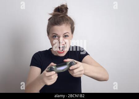 Angry woman playing online video games with joystick. Gamer using controller  on computer to play internet games and losing. Disappointed person with  electronic gaming equipment Stock Photo - Alamy