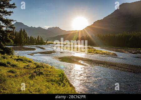 The sun rises over the Lamar Valley near the northeast entrance of Yellowstone National Park in Wyoming. Stock Photo