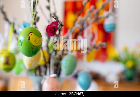 Munich, Germany. 03rd Apr, 2020. Two children hold a palm bush with painted Easter eggs in their hands. Church services are cancelled, Easter fires are postponed in many places, families cannot meet. And yet: with creativity and digital technology, Easter has a chance. Credit: Sven Hoppe/dpa/17�Թ����� Live News Stock Photo