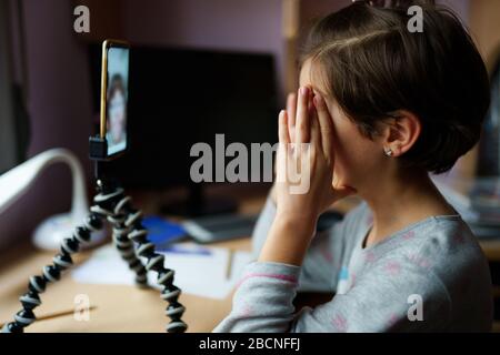 Little girls talking via video conference with smartphone Stock Photo