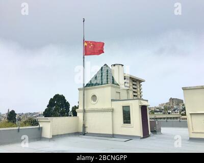 (200405) -- SAN FRANCISCO, April 5, 2020 (Xinhua) -- A Chinese national flag flies at half-mast to mourn for martyrs who died in the fight against the novel coronavirus disease (COVID-19) outbreak and compatriots who died of the disease at the Consulate-General of the People's Republic of China in San Francisco, the United States, April 4, 2020. (Chinese Embassy to U.S./Handout via Xinhua) Stock Photo
