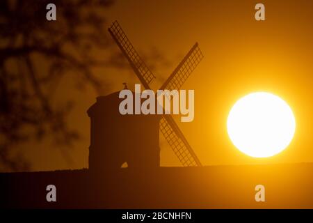 The sun rises over Chesterton Windmill in Warwickshire. Stock Photo