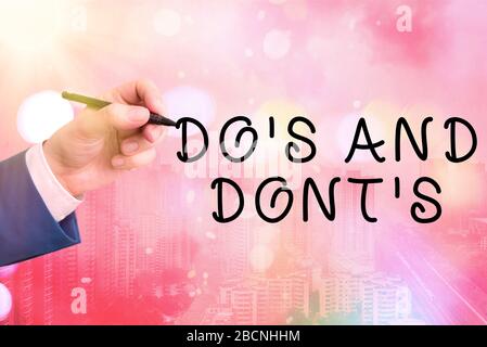 Conceptual hand writing showing Do Is And Dont Is. Concept meaning advising Rules or customs concerning some activity Stock Photo