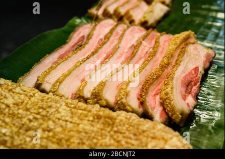 Slices of a fresh meat breading. Thai street food at outdoor night market in Thailand. Stock Photo
