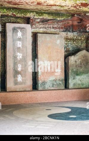 Steles of Lingyun Temple, Taoist symbols including yin yang and bagua. Leshan, Sichuan Province, China Stock Photo