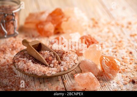 Himalayan pink rock salt in bowl with scoop Stock Photo