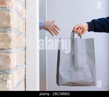 Food delivery to the home during the coronavirus Stock Photo