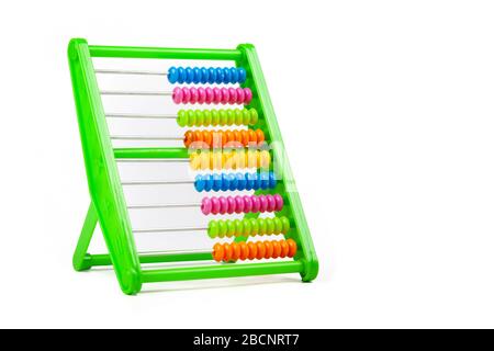 Simple colorful classic abacus toy isolated on white, cut out, beads aligned. Teaching aids, accessories. Kids, children math, fun arithmetics Stock Photo