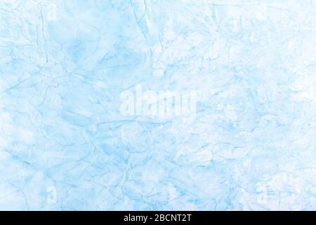 Simple light blue abstract background texture, blue ice like winter cold surface, creased, crumpled paper cracks, uneven structure artsy backdrop Stock Photo