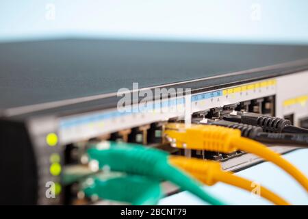 Network switch and connected different ethernet cable Stock Photo