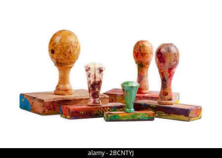 Set of wooden stamps. Group of dirty hand stamps made from wood covered in paint isolated on white, many various sizes. Painting, art accessories Stock Photo