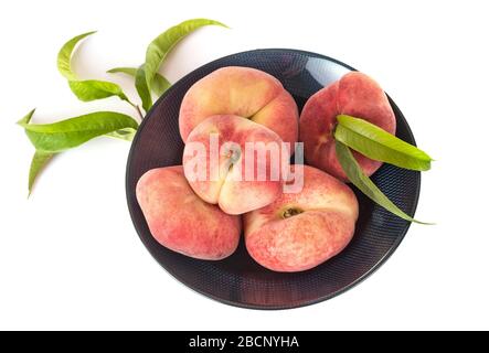 Saturn peaches in front of white background Stock Photo