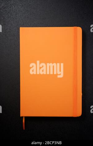 Notebook view on a black table. Stock Photo