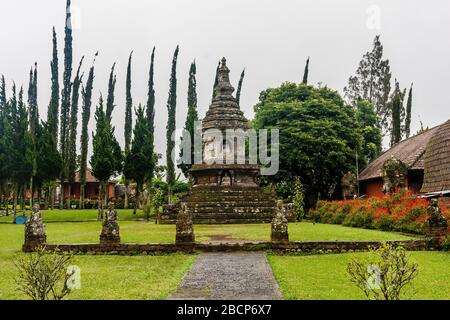 A stupa with statues of Buddha in Ulun Danu Beratan temple, Bali, Indonesia Stock Photo