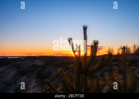 Sunset against the backdrop of large obese clouds.  Stock Photo