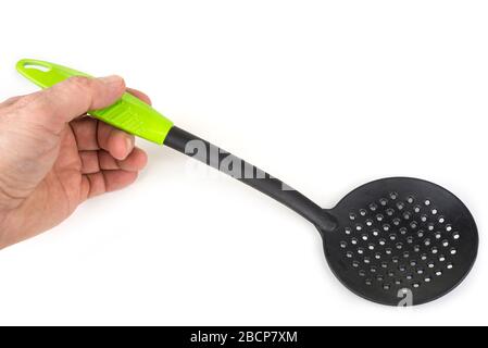 Plastic kitchen French Fries Slotted Spoon on a white background Stock Photo